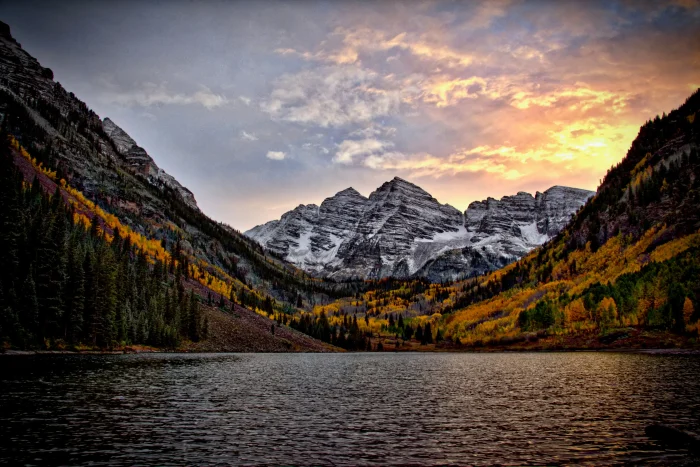 Mountains with lake in foreground at sunset